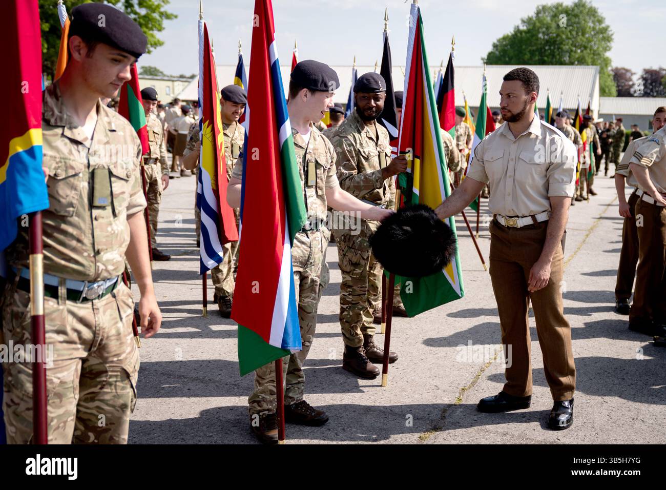 Members of the Armed Forces carry flags as they take part in a ...