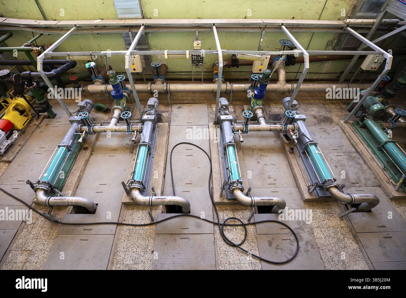 Electric pumps in a wastewater treatment facility Stock Photo