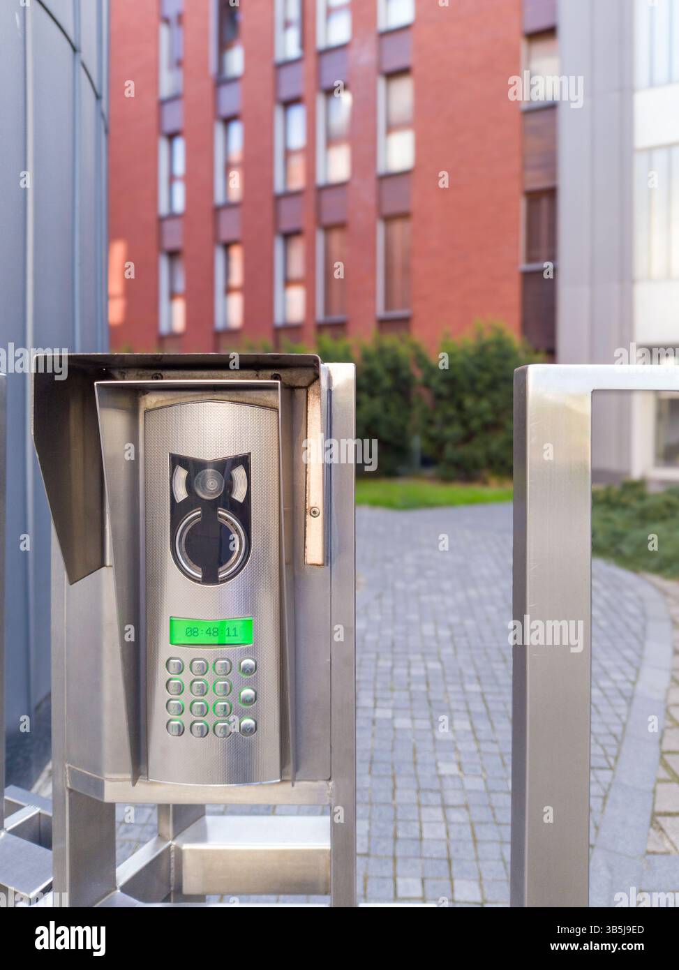 Modern video intercom system at gated entrance Stock Photo