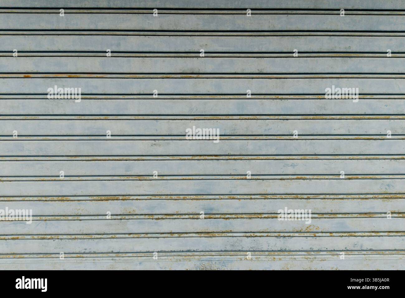 Rusty metal roller shutter garage door texture Stock Photo
