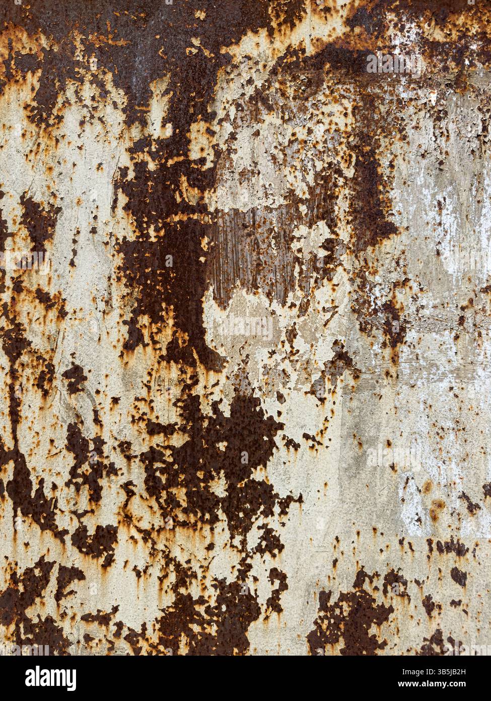 Vertical close-up of rusty metal surface with peeling paint and corrosion marks. Abstract industrial texture, weathered material, no people. - Smartphone Captured Stock Image