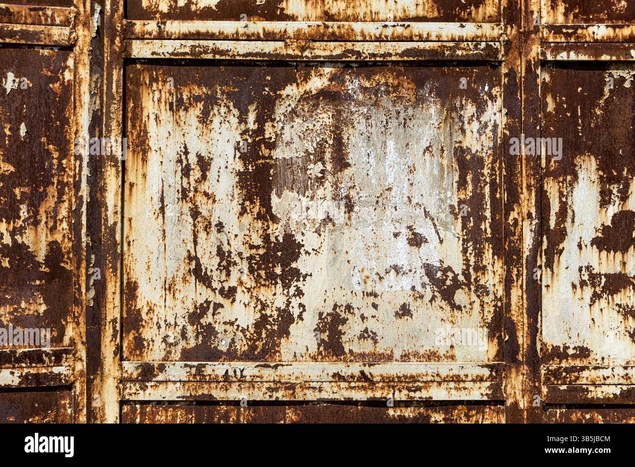 Close-up of rusty metal panel with peeling paint and heavy corrosion. Industrial texture, aged surface, abstract background, no people. - Smartphone Captured Stock Image