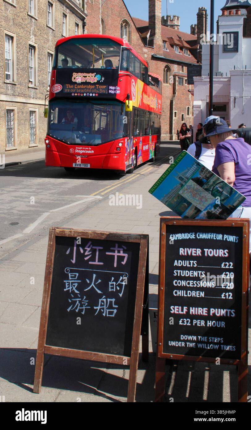 Open top City Sightseeing bus in Cambridge's historic city centre by Queen's College and the River Cam in spring. UK Stock Photo