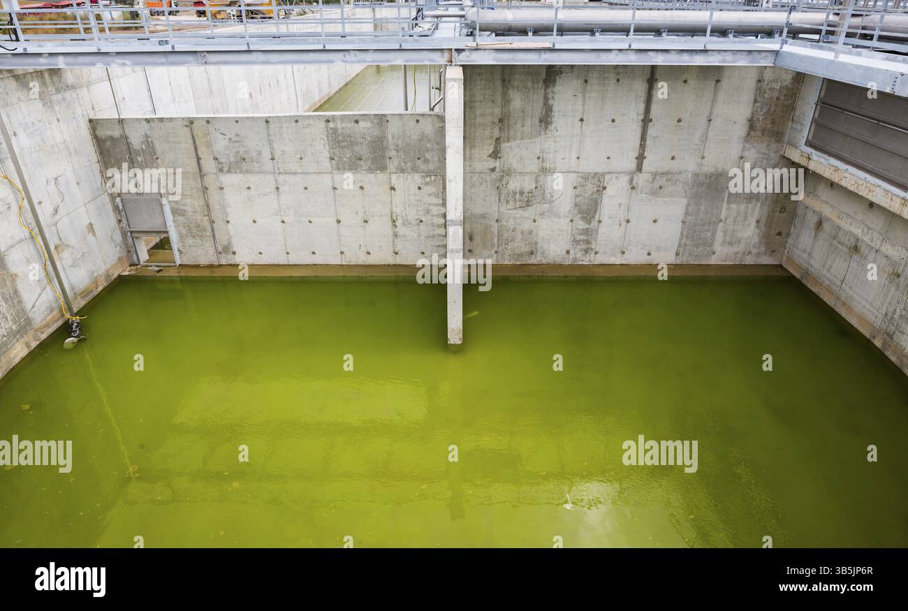 Modern urban wastewater treatment plant. Water cleaning facility outdoors. Water purification is the process of removing undesirable chemicals, suspen Stock Photo