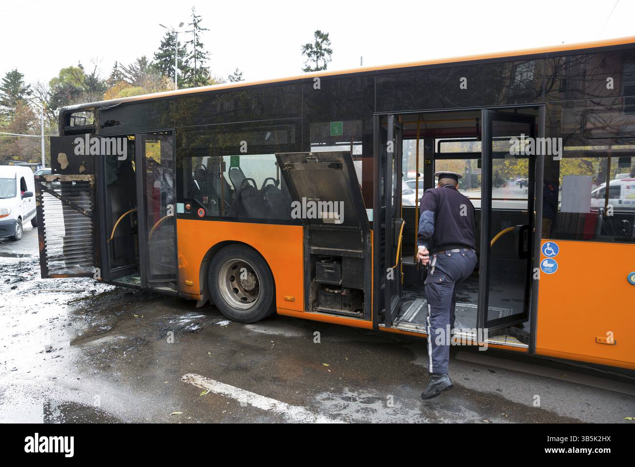 Burnt public traffic bus is seen on the street after caught in fire ...