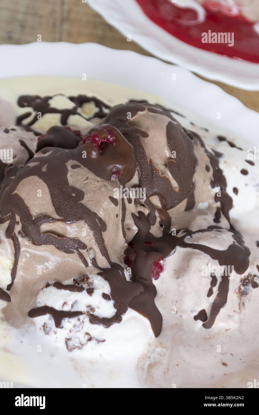 Chocolate ice cream on the table raspberry dressing Stock Photo