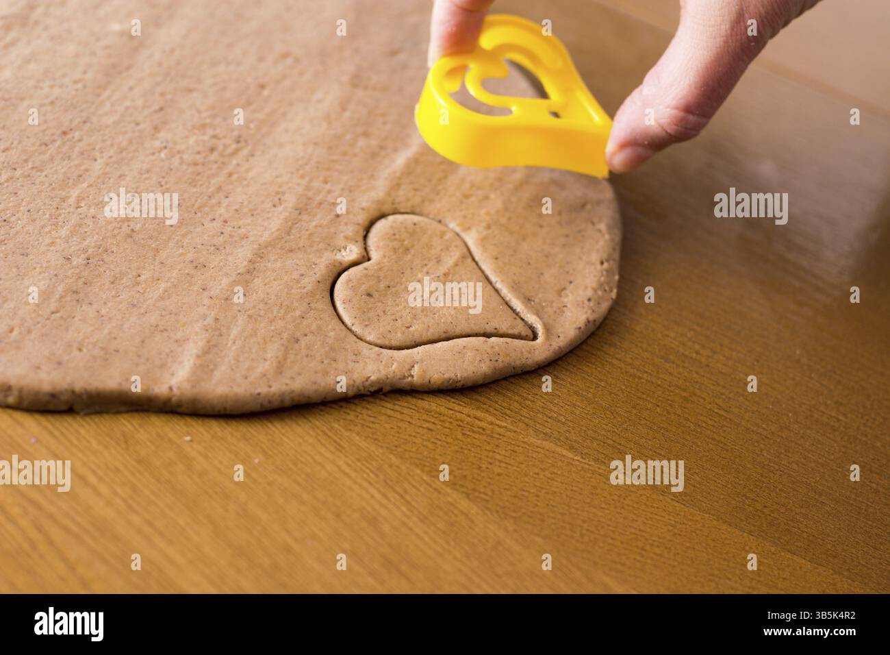 Preparing easter gingerbread cookies. Steps of making pastry Stock Photo