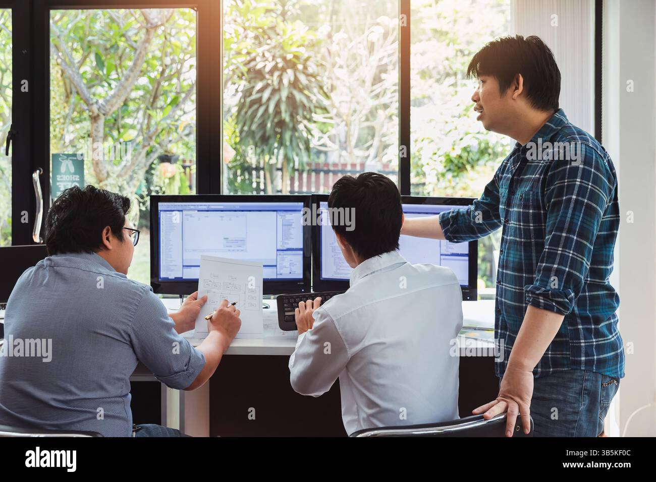 Programmers team working in a software developing. Developing programming and coding technologies. Website design. Cyber space concept. Stock Photo