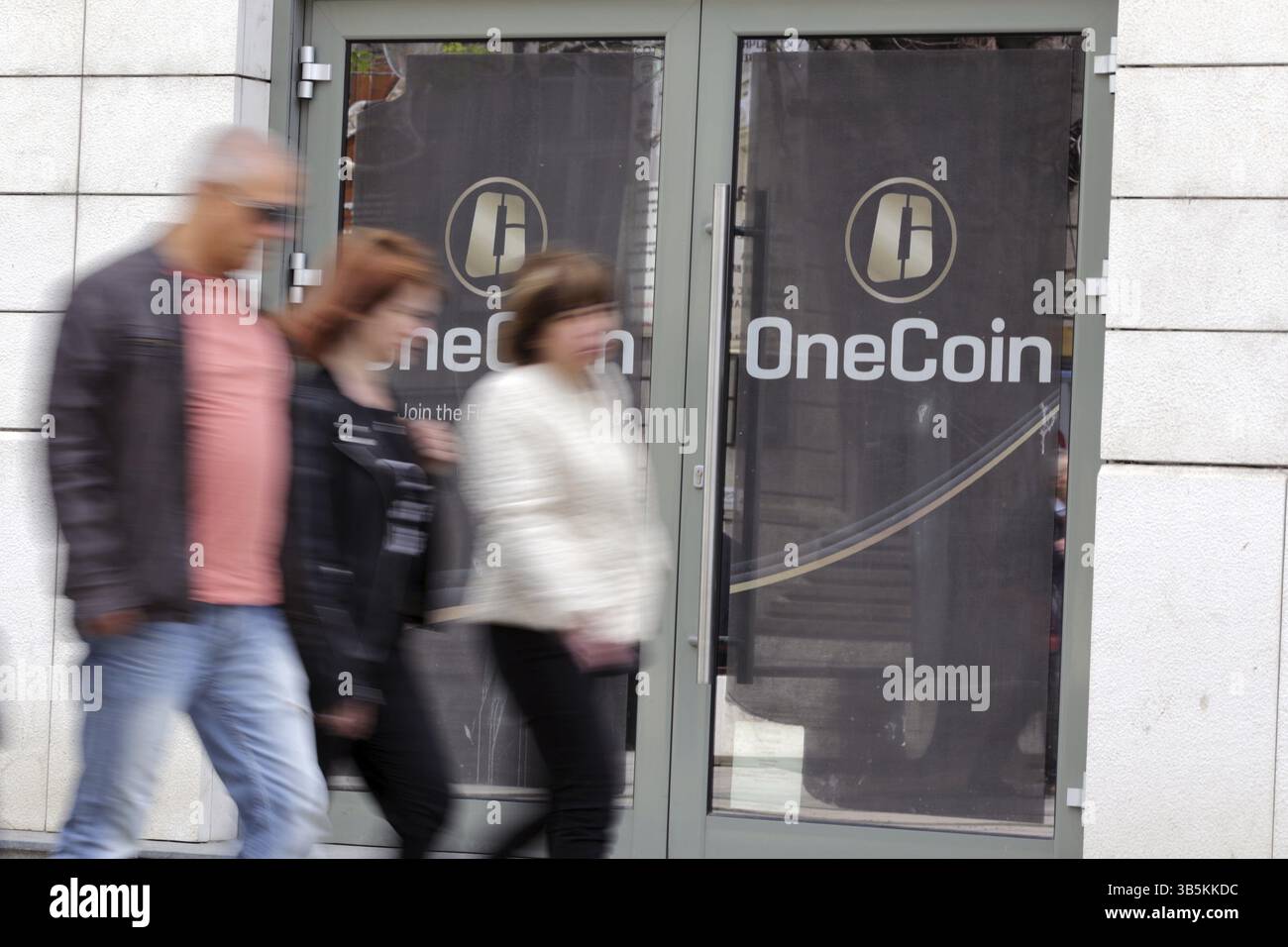 Sofia, Bulgaria - 12 May, 2019: People pass by the office of OneCoin  cryptocurrency founded by Ruja Ignatova Stock Photo - Alamy