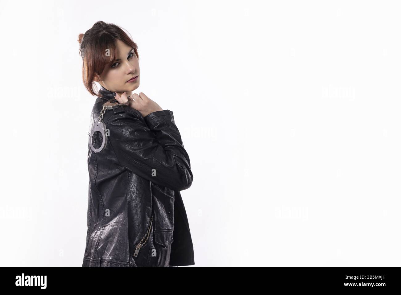 A stylish model confidently showcases a sleek leather jacket in a ...