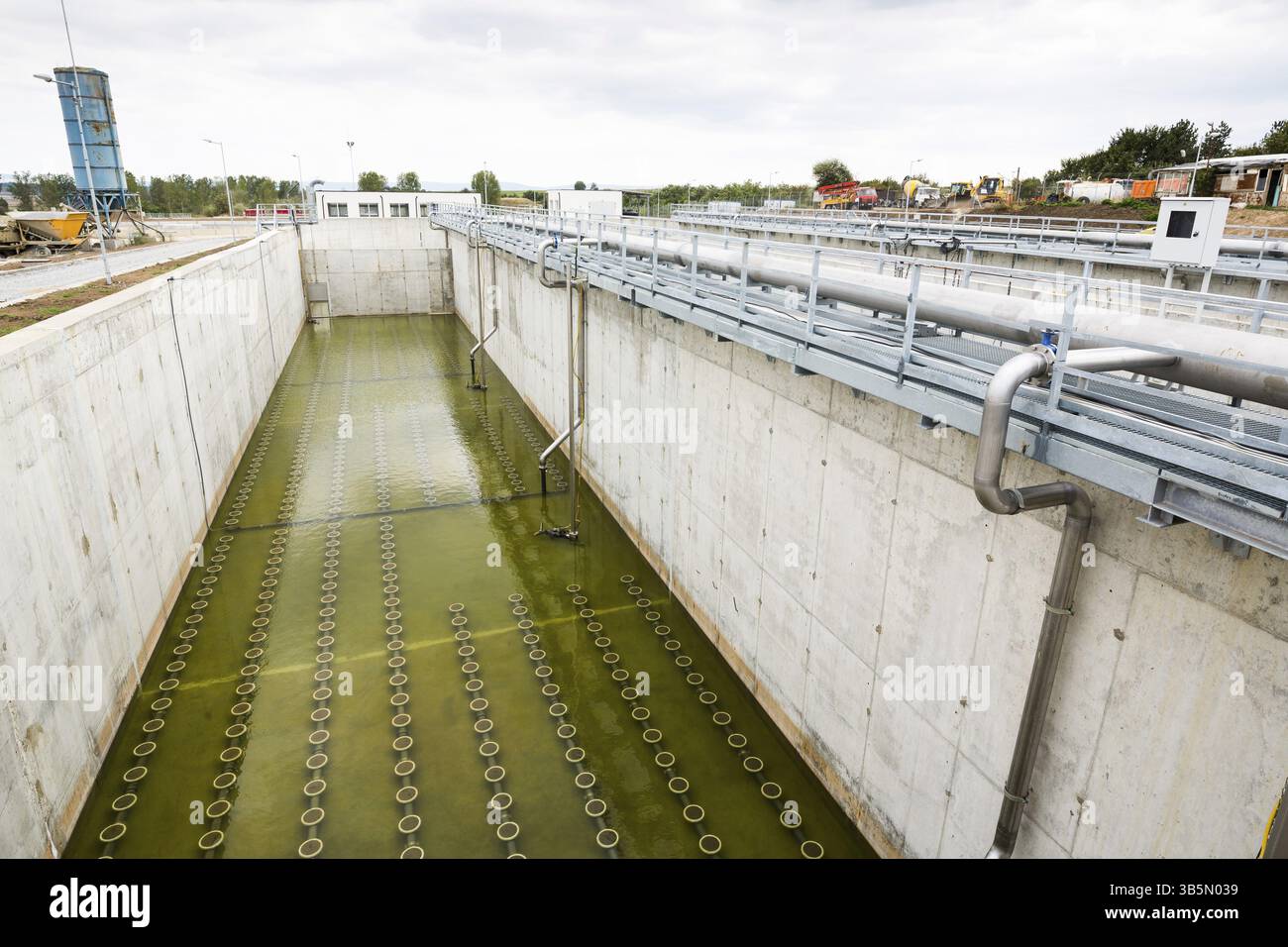 Modern urban wastewater treatment plant. Water cleaning facility outdoors. Water purification is the process of removing undesirable chemicals, suspen Stock Photo