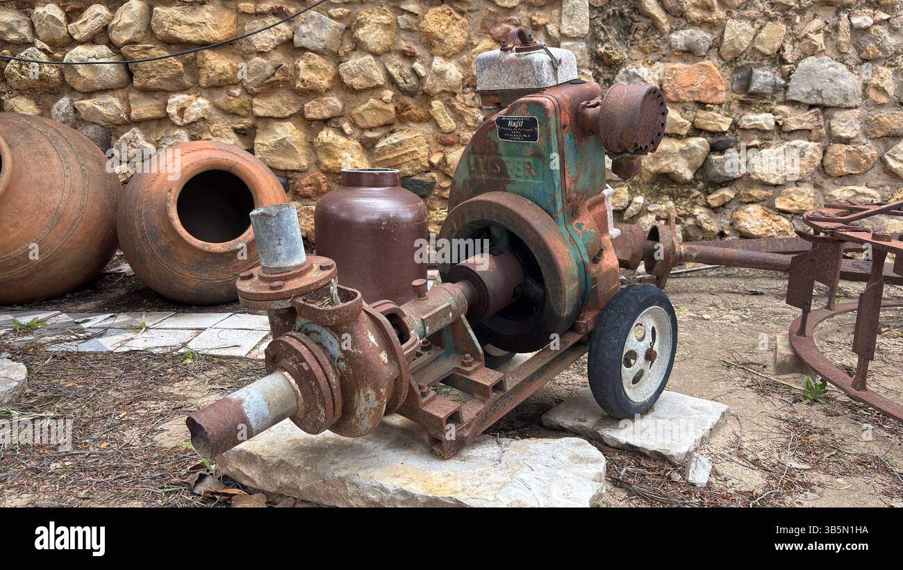 Abandoned rusty diesel generator and broken ceramic pots discarded ...
