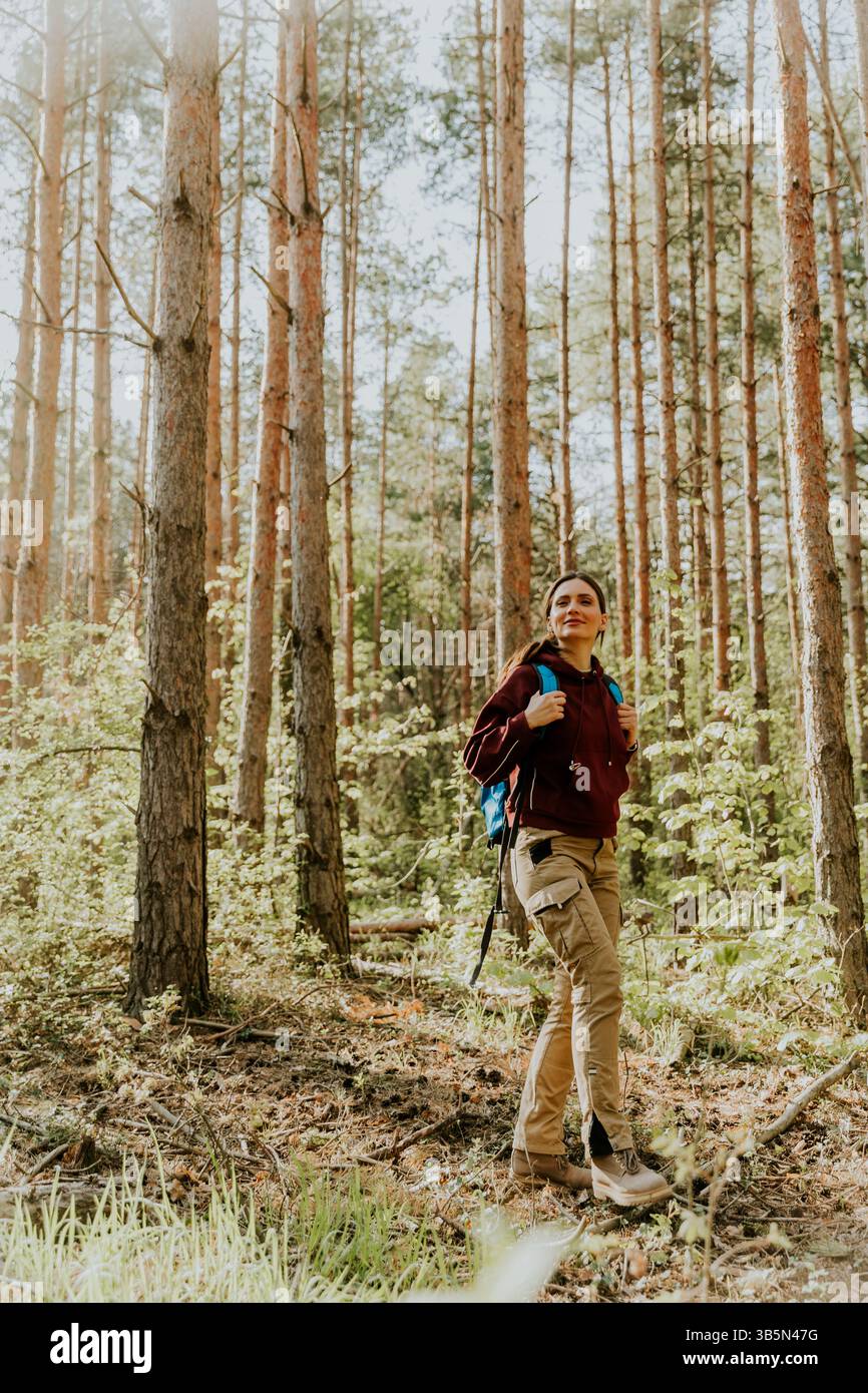 Young woman walks through forest hi-res stock photography and images ...
