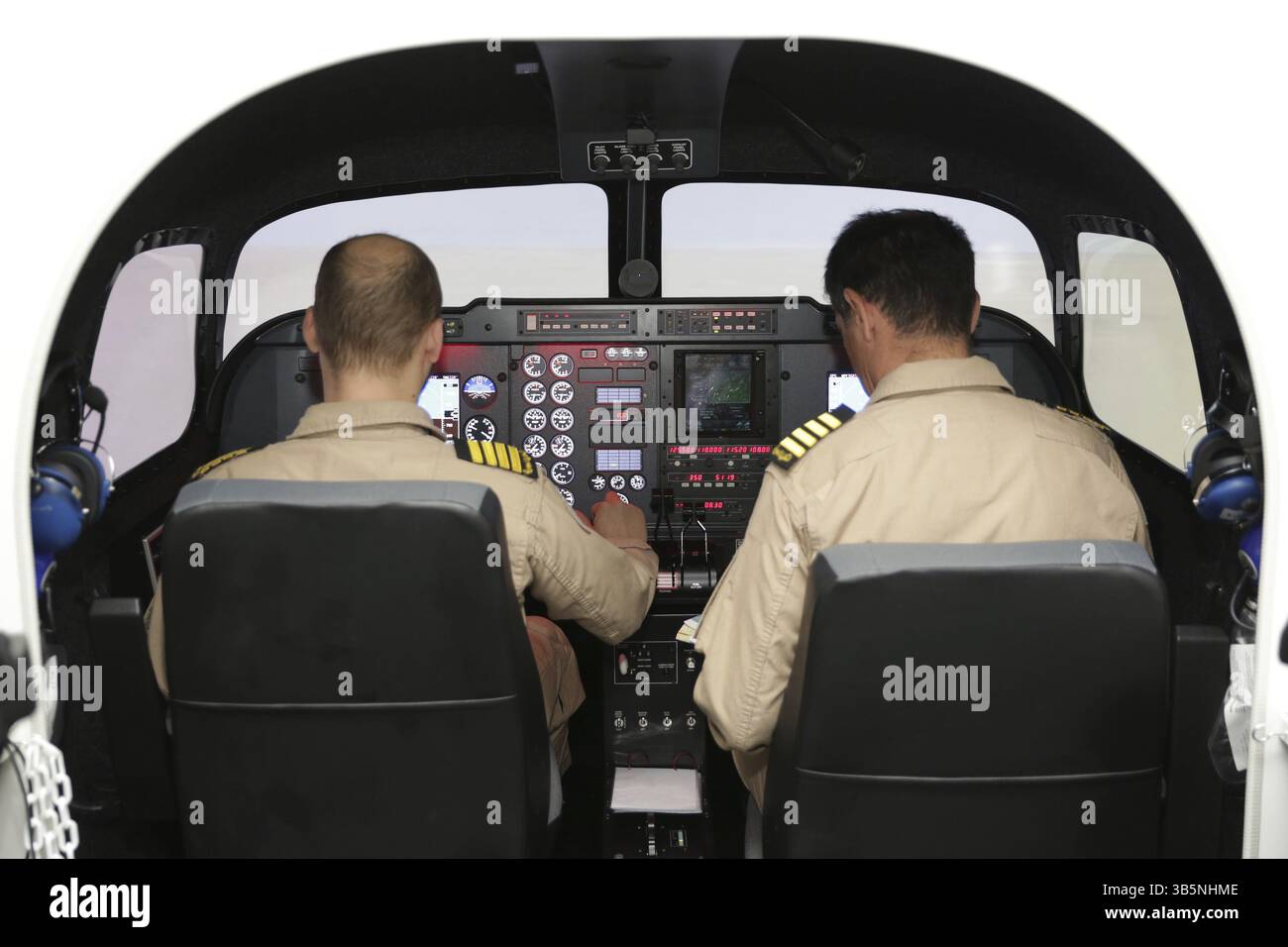 Fighter aircraft simulator training room with two pilots. A flight ...
