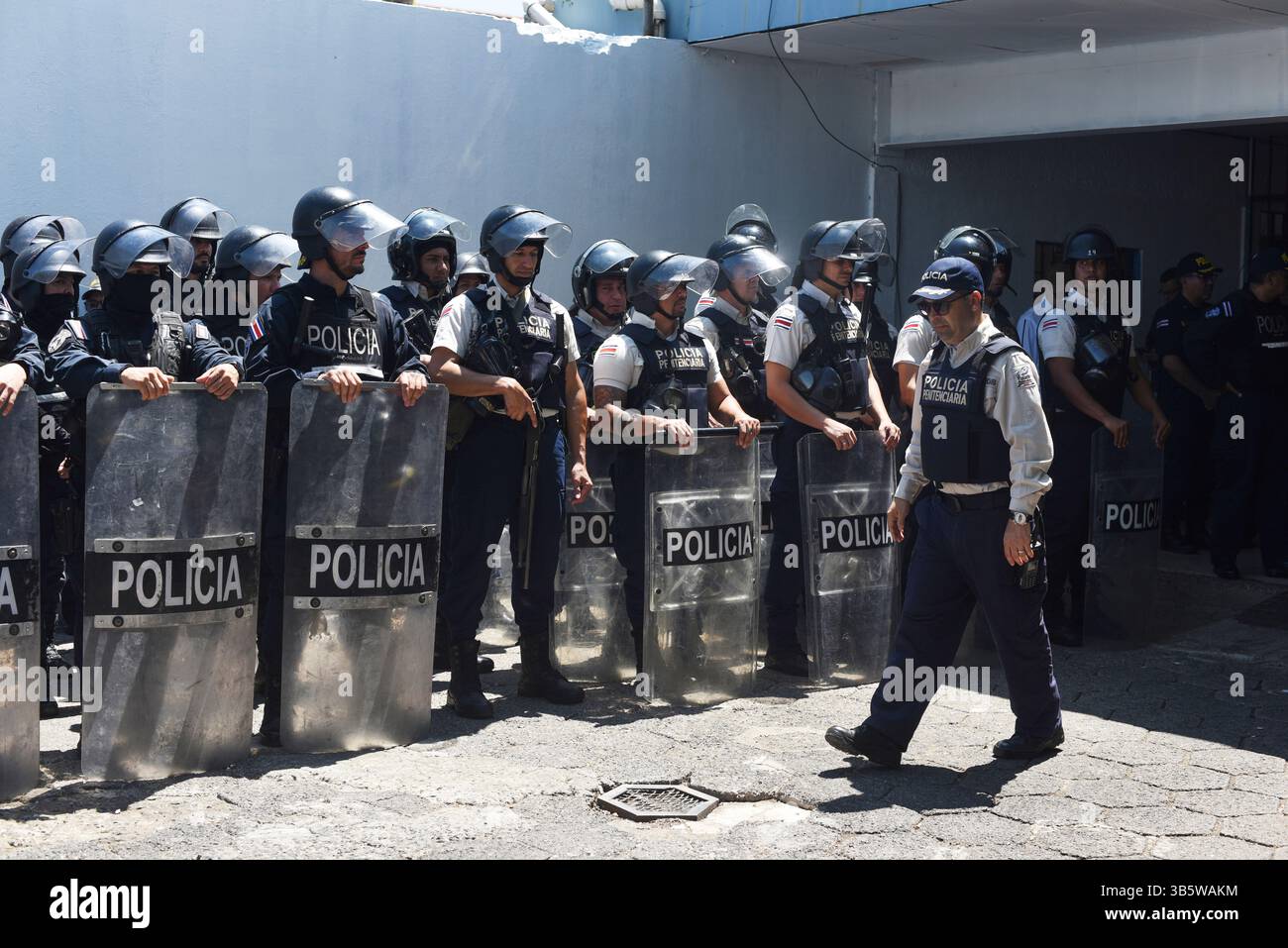 Police stand guard outside La Reforma Penitentiary Center during a ...
