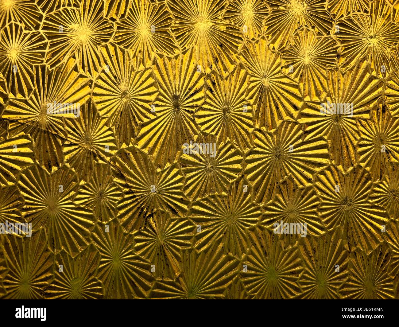 Vintage Victorian-era yellow patterened window glass with stylised flowers, known as Muranese or Florentine style, Yungaburra Hotel, Queensland, Austr - Smartphone Captured Stock Image