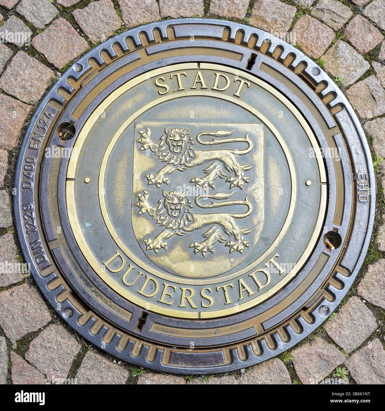 Manhole cover with coat of arms and inscription City of Duderstadt, Lower Saxony, Germany, Europe Stock Photo