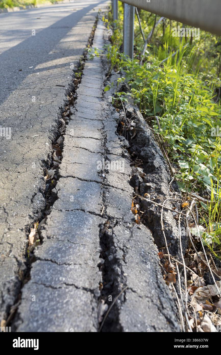 Broken asphalt on the side of a country road, Toepeln, Doebeln, Saxony, Germany, Europe Stock Photo