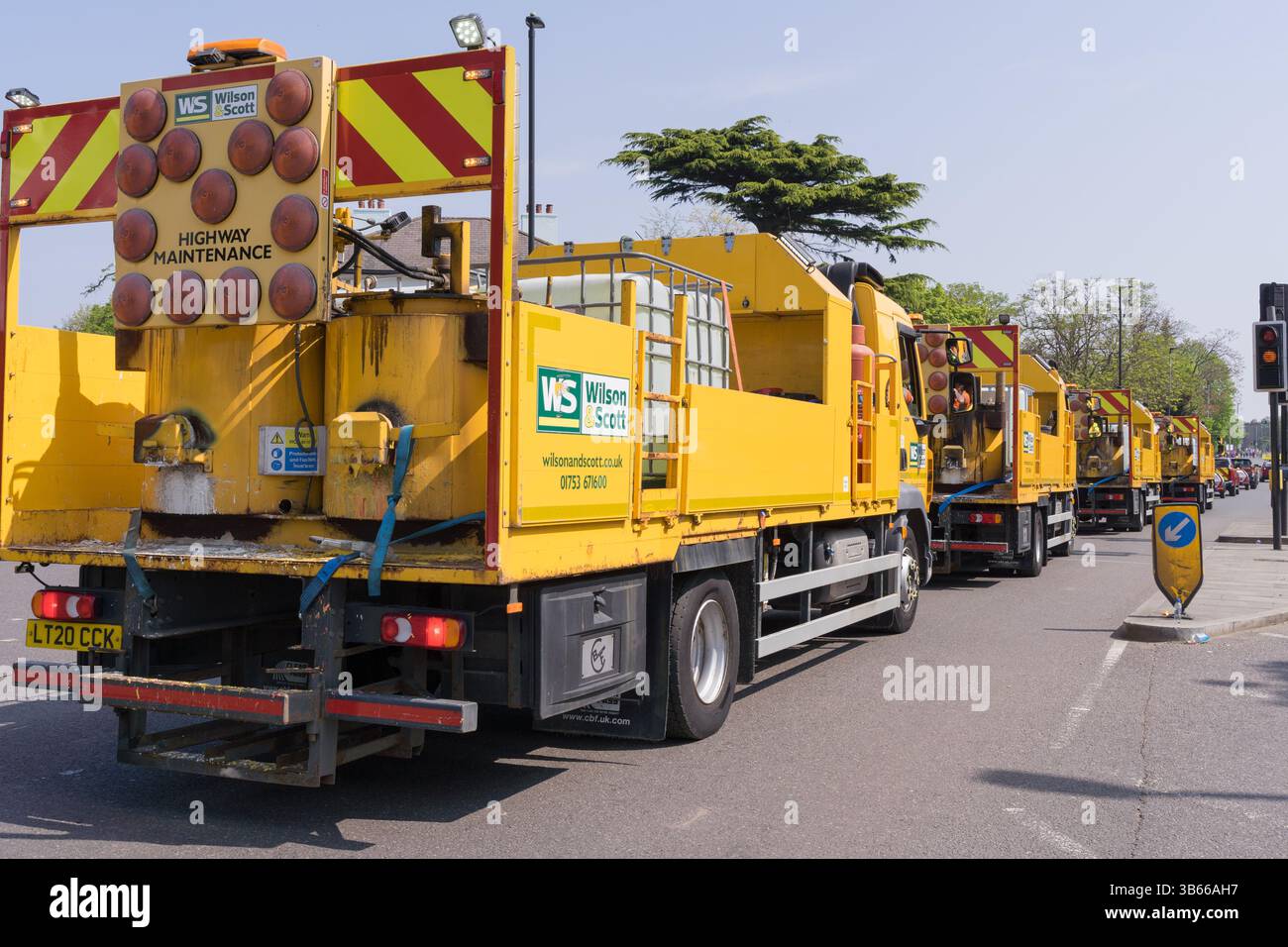 road cleaning vehicles stand by for immediate action to clean up race route soon after the last runner clear the marathon starting point London UK Stock Photo