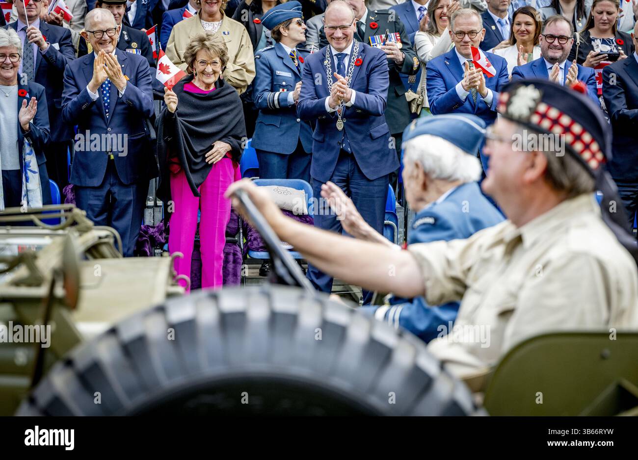 APELDOORN - Princess Margriet and Pieter van Vollenhoven during a street parade with the United Pipers for Peace in memory of war victims. During the street parade, (grand)children of Dutch veterans walked along with relatives of Canadian veterans. ANP ROBIN UTRECHT netherlands out - belgium out Stock Photo