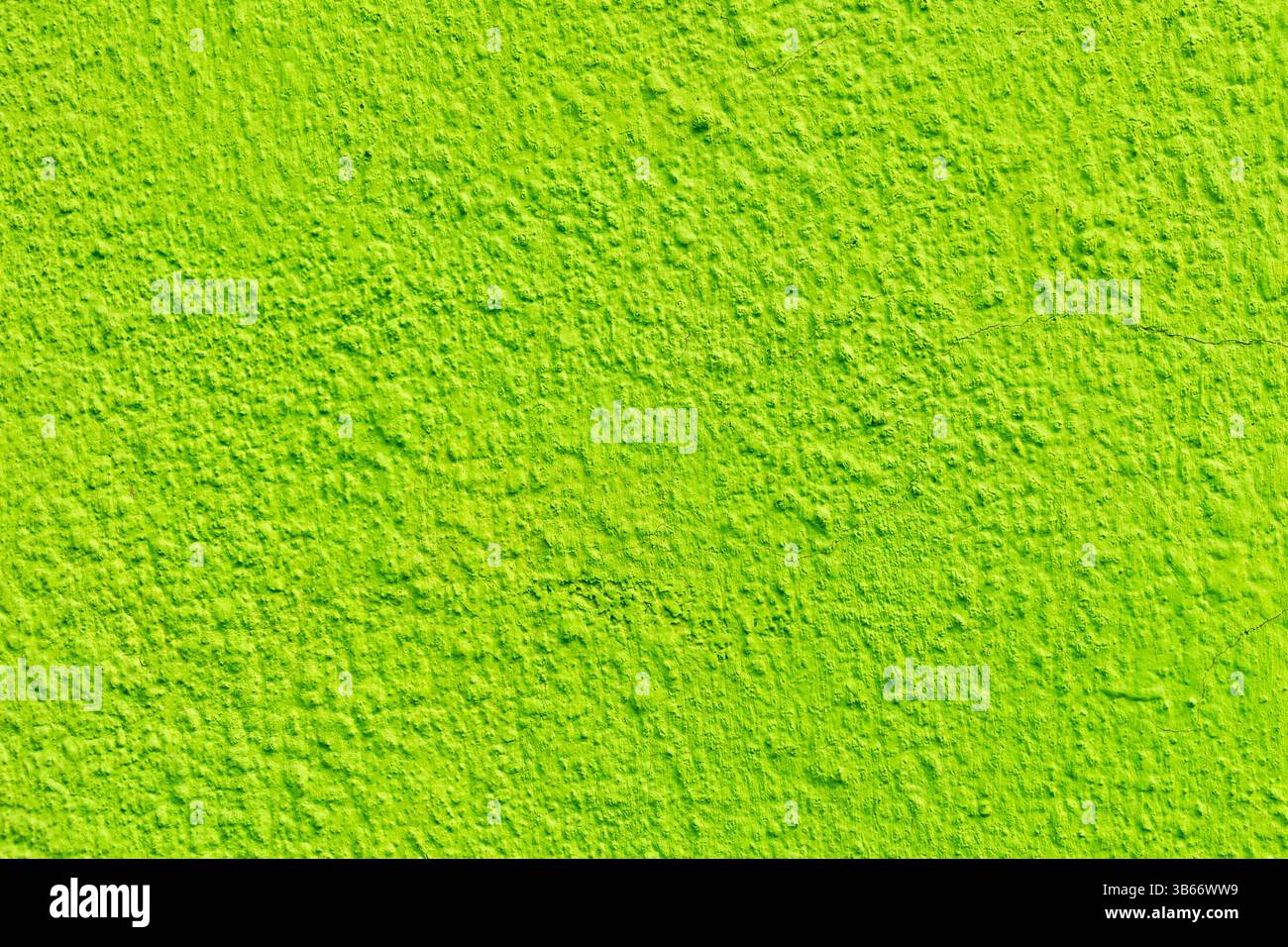 Bright lime green textured wall surface. Stock Photo