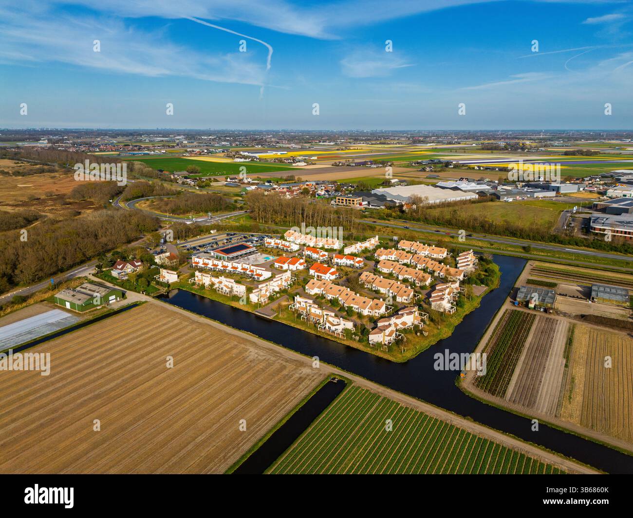Aerial view of a peaceful suburban neighborhood surrounded by fields ...