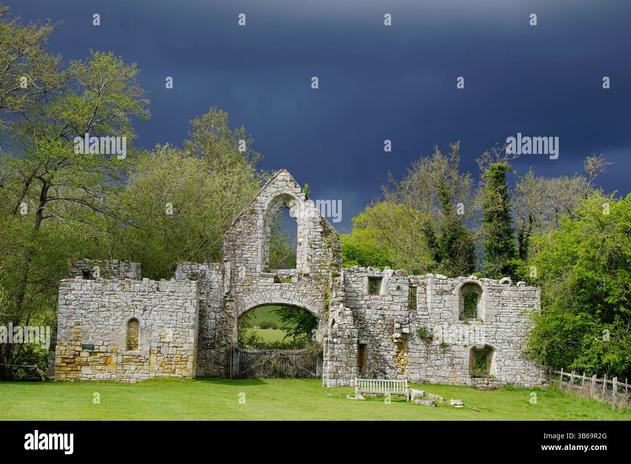Stone Priory Medieval stone abbey ruins in the English countryside under a dramatic ...