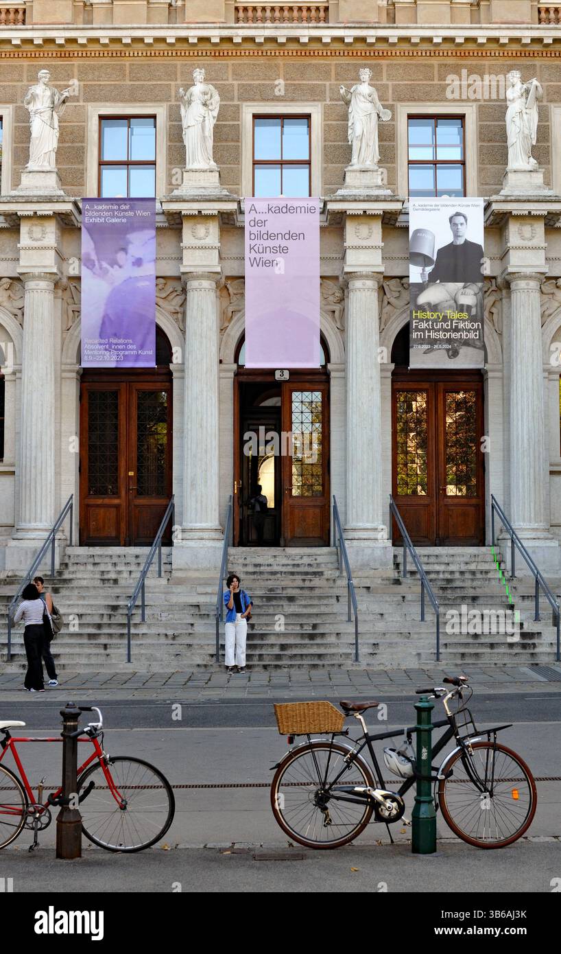 Statues and columns flank the entrance to the main building of the