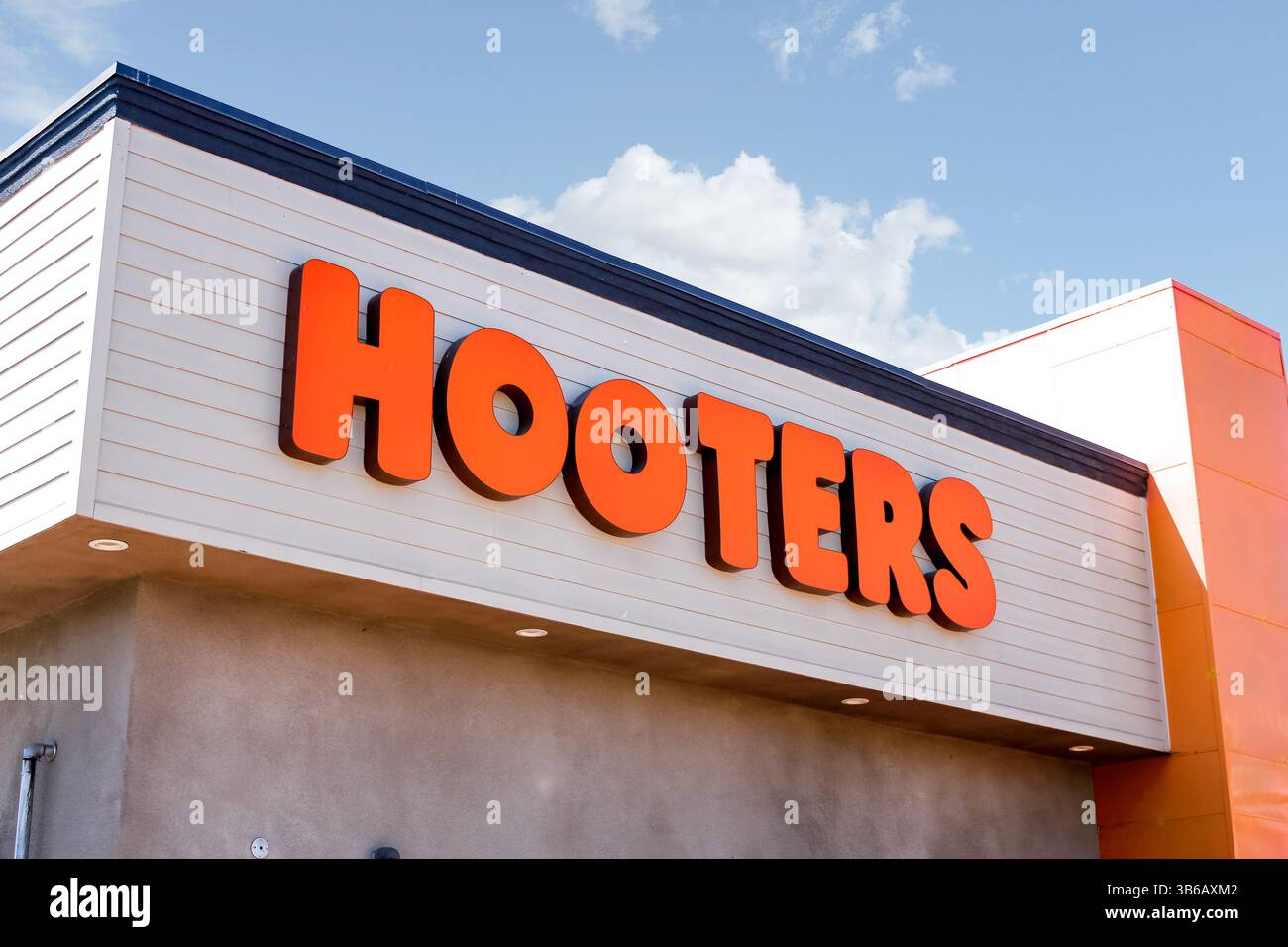 Long Beach, California, United States - 09-07-2019: A view of a store front sign and logo for the restaurant chain known as Hooters. Stock Photo