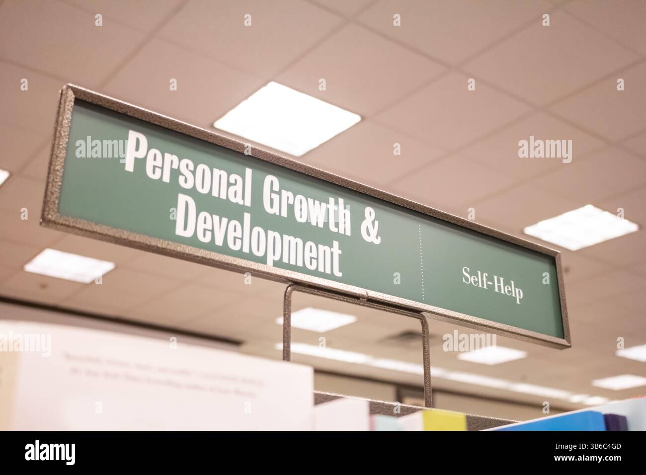 A view of a genre sign at a bookstore that says Personal Growth and Development. Stock Photo