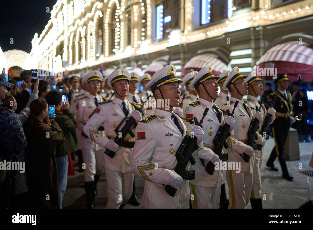 Chinese People's Liberation Army soldiers march past the GUM department ...