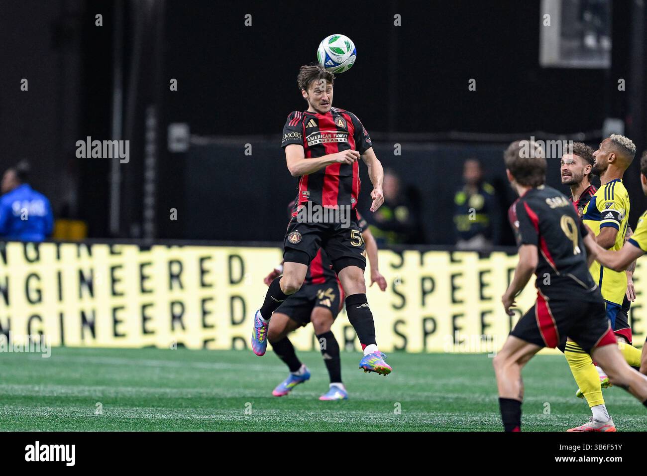 ATLANTA, GA – MAY 03: Aleksey Miranchuk #59 of Atlanta heads the ball ...