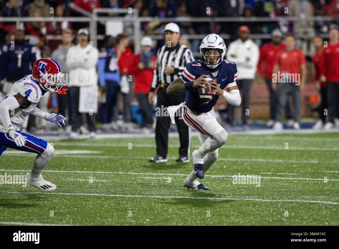 Liberty quarterback Kaidon Salter (7) scrambles with the