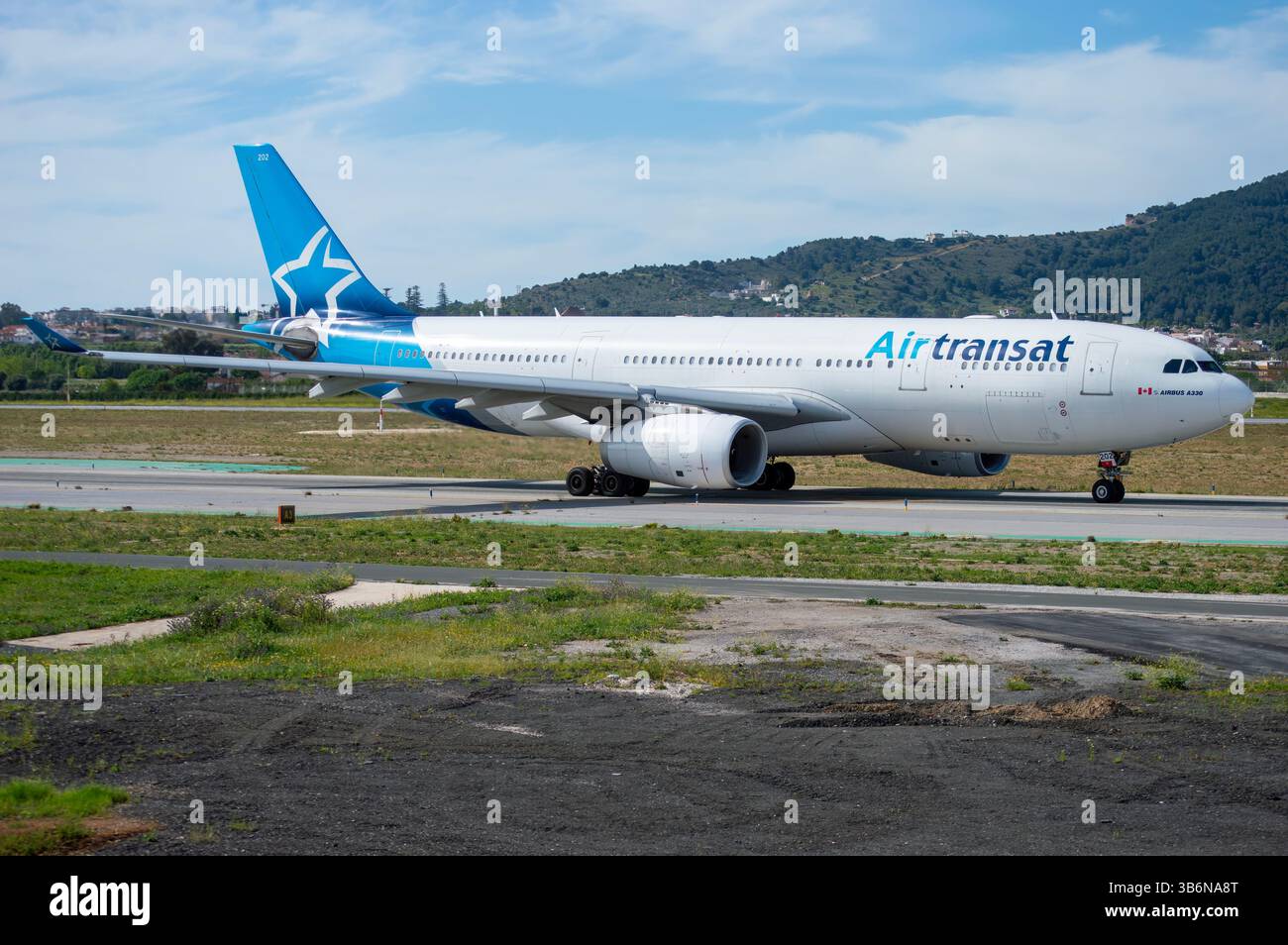 Canadian airline Air Transat's Airbus A330-200 long-haul airliner at Málaga Costa del Sol Airport, registration C-GTSZ Stock Photo
