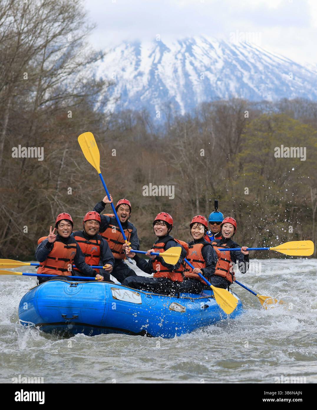 Japanese Raft People enjoy river rafting through the river rapids of the Shiribetsu ...