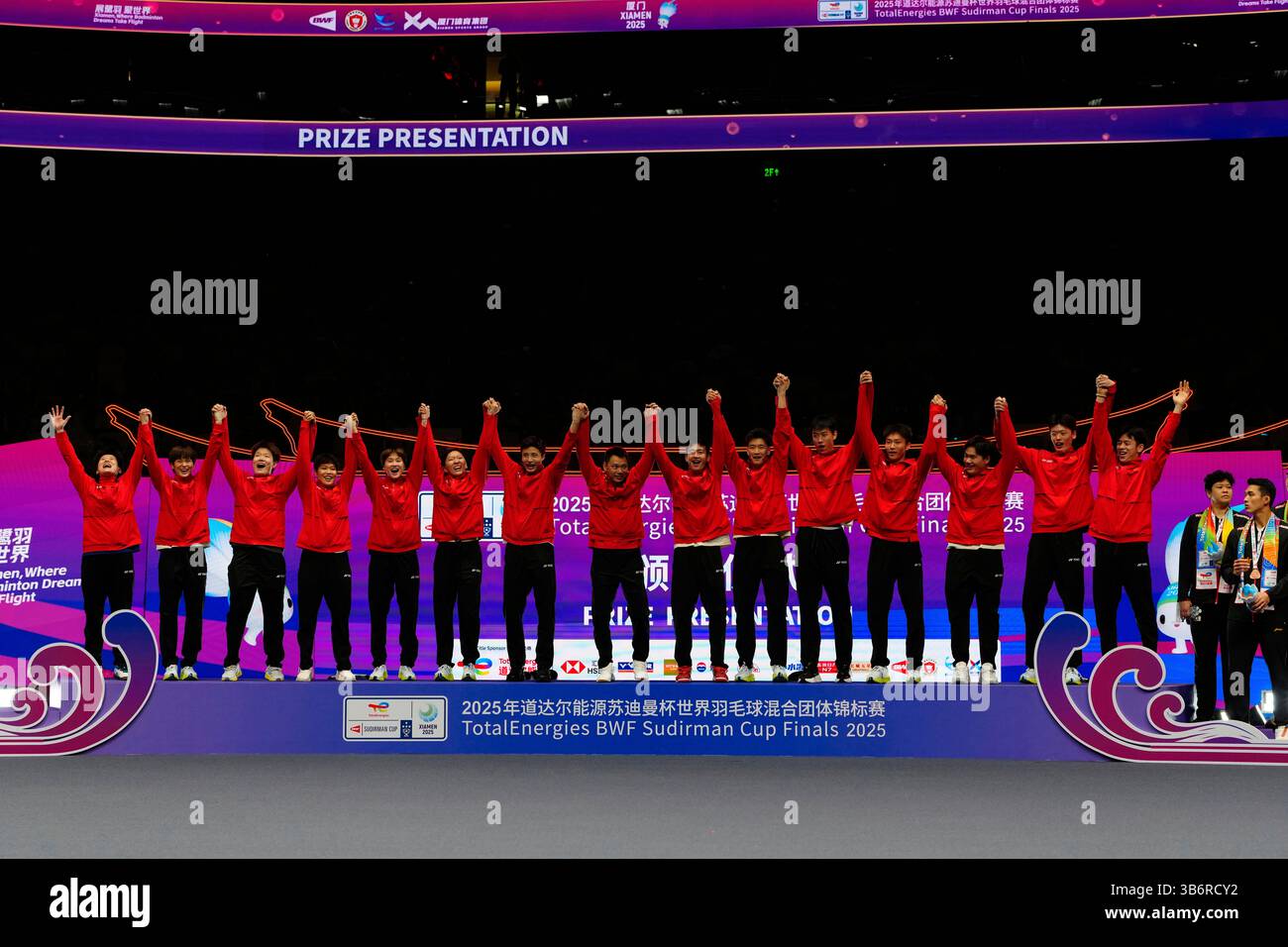 Gold medalists team China celebrate on the podium at the BWF Sudirman ...