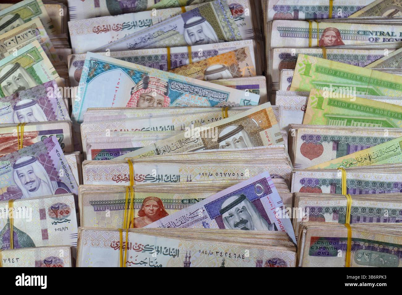 Saudi Arabia riyals SAR cash money bills banknotes and Piles of Egypt ...