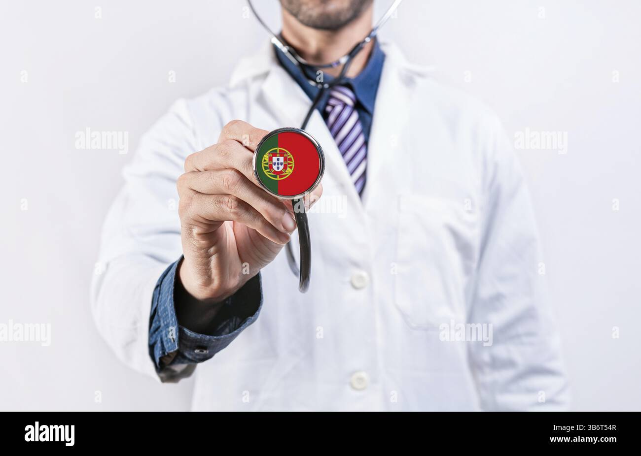 Portugal healthcare system, doctor holding stethoscope. Portugal health and medical insurance concept Stock Photo
