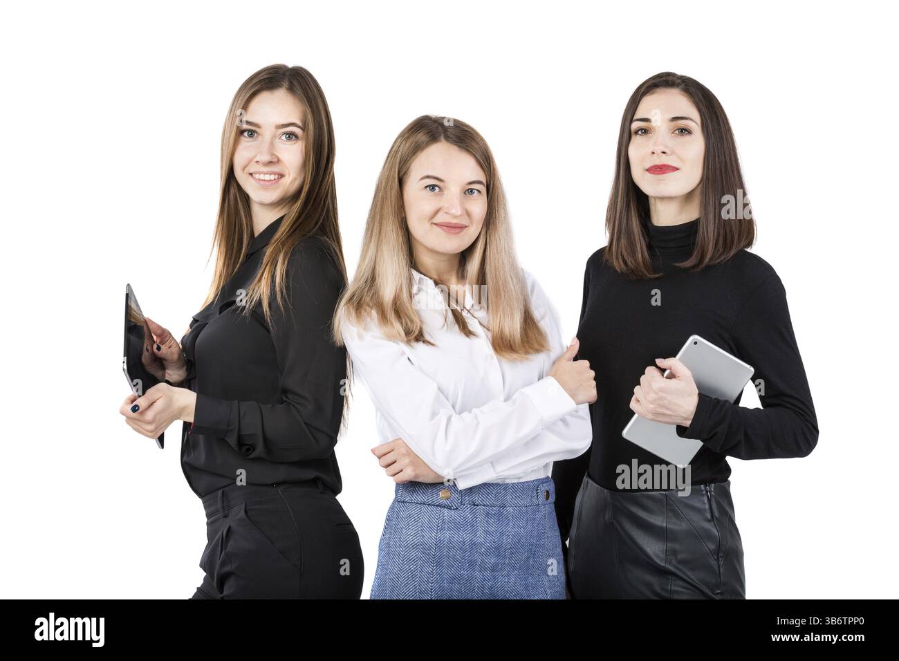 Three smiling business women standing in a row isolated on white ...