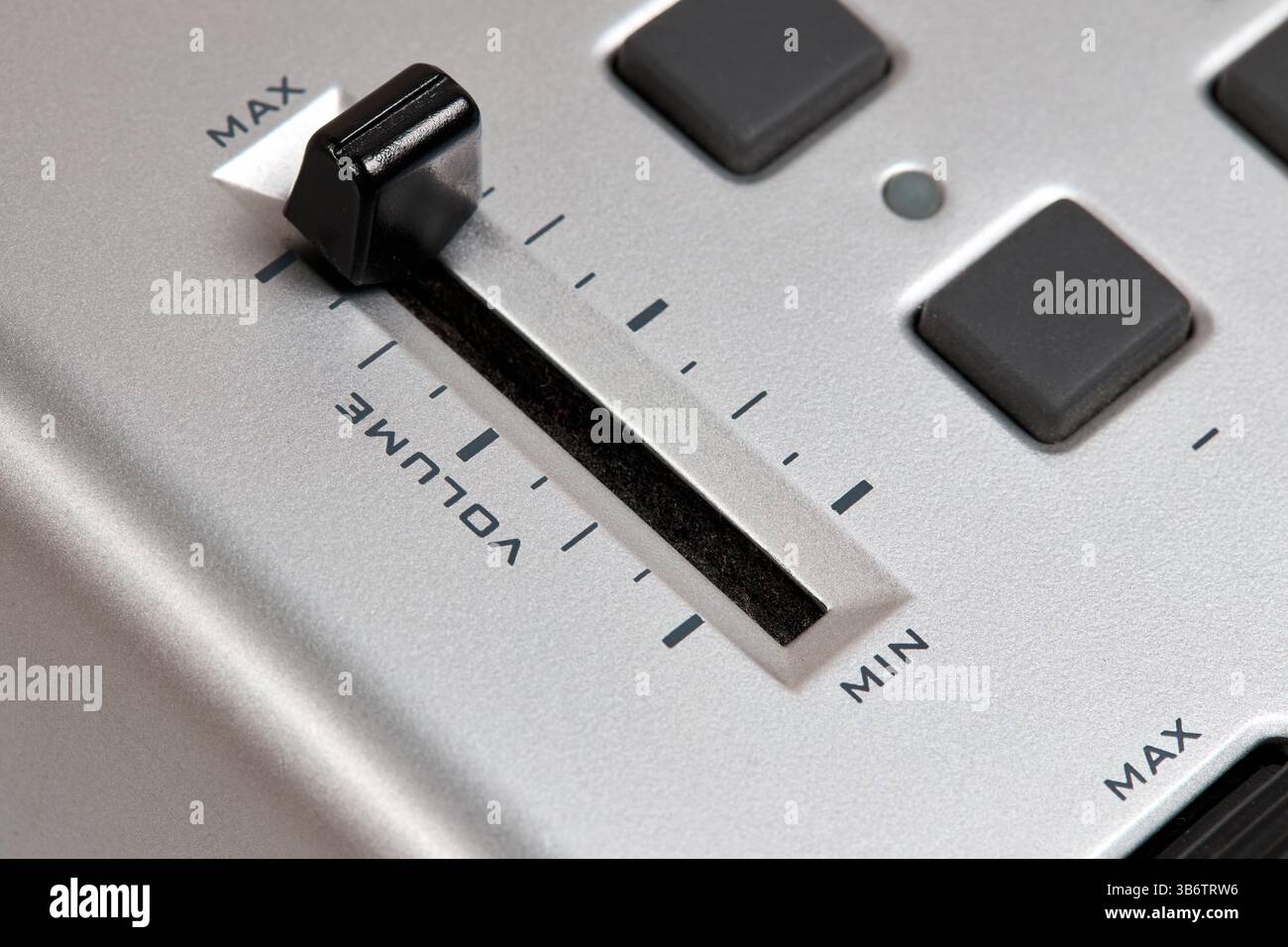 Midi keyboard controller close up with faders wheel buttons and knobs pitch, band, modulation, octave max min Stock Photo