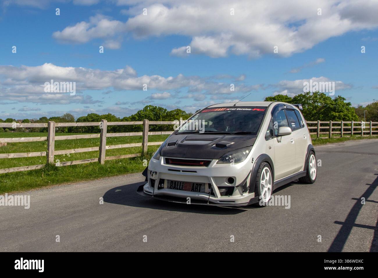 Mitsubishi Colt Ralliart Version-R 1.5M a performance-oriented hot hatch, known for its 1.5-litre turbocharged engine and Ralliart-tuned enhancements. It was released in Japan on May 30, 200; .Japanese cars attend a rally at Heskin Hall, UK Stock Photo