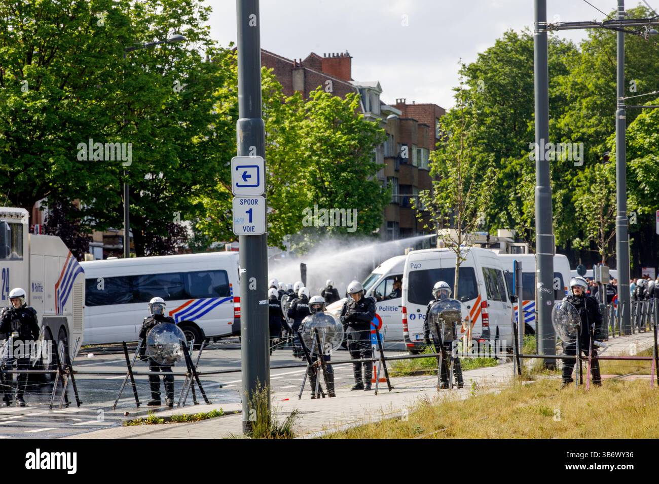 Brussels, Belgium. 04th May, 2025. Riot police and soccer fans pictured ...