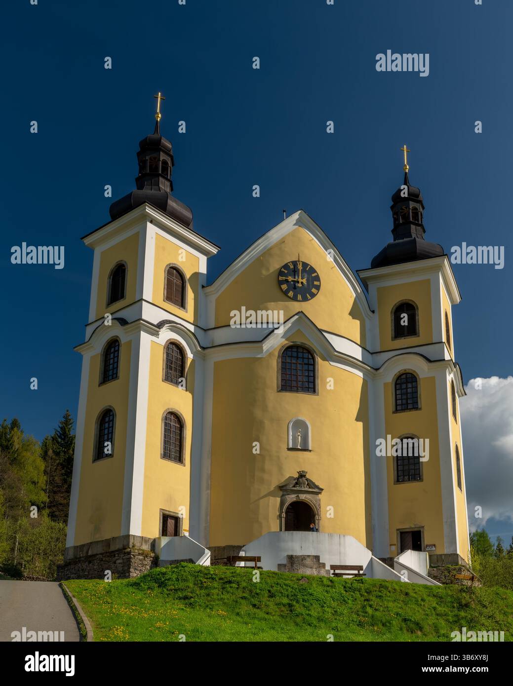 Sunny spring color morning near nice yellow church with glass roof in Neratov CZ 04 30 2025 Stock Photo