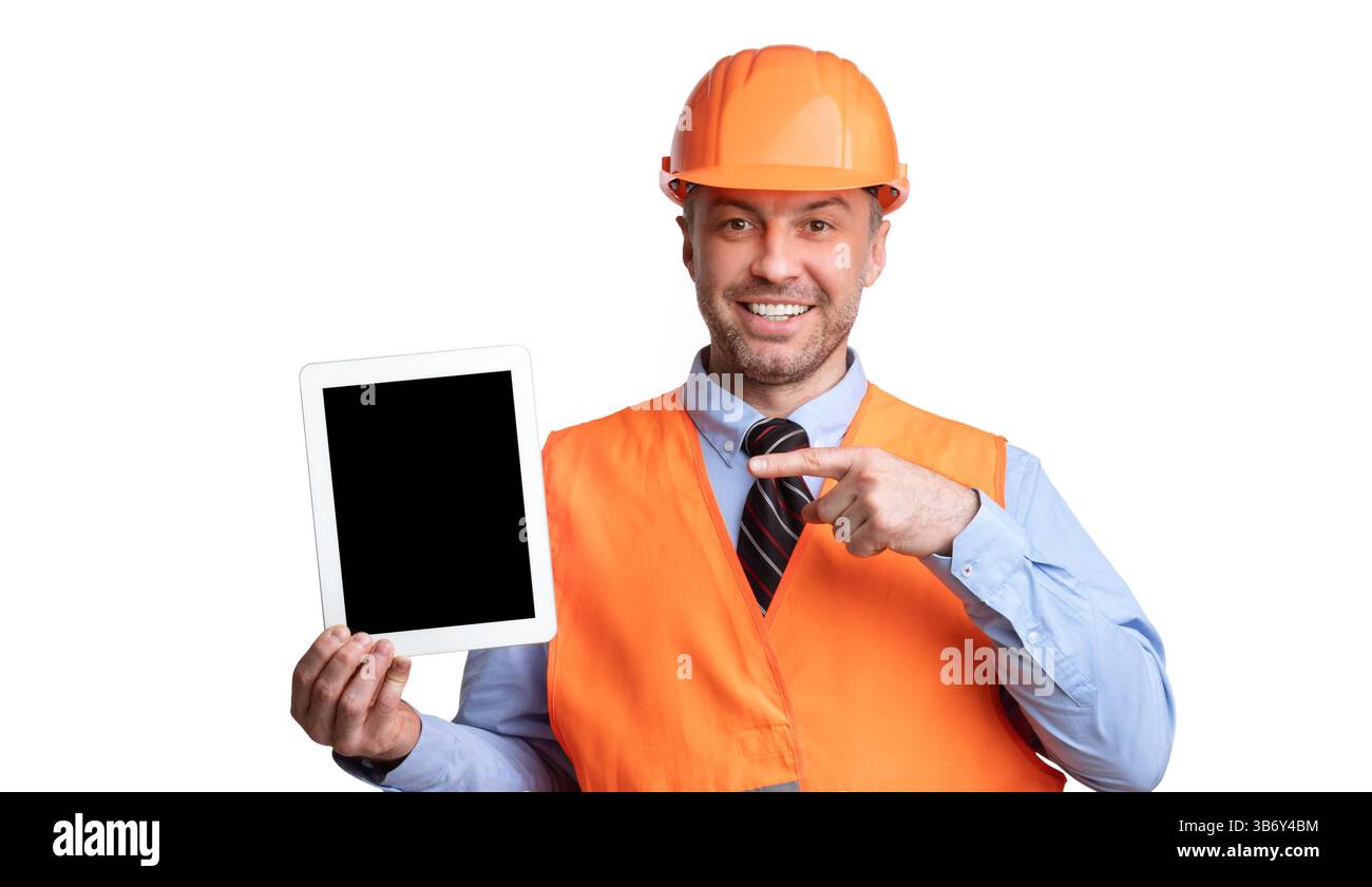 Builder Showing Tablet Pointing Finger At Empty Screen, White Background Stock Photo
