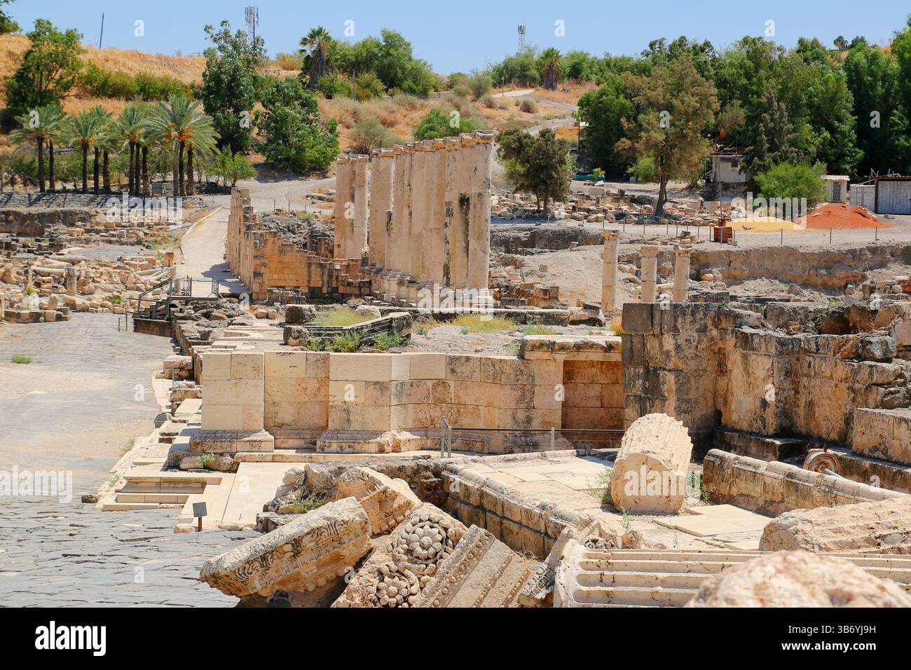 Collapsed Roman columns among ruins in the archaeological site of Beit ...