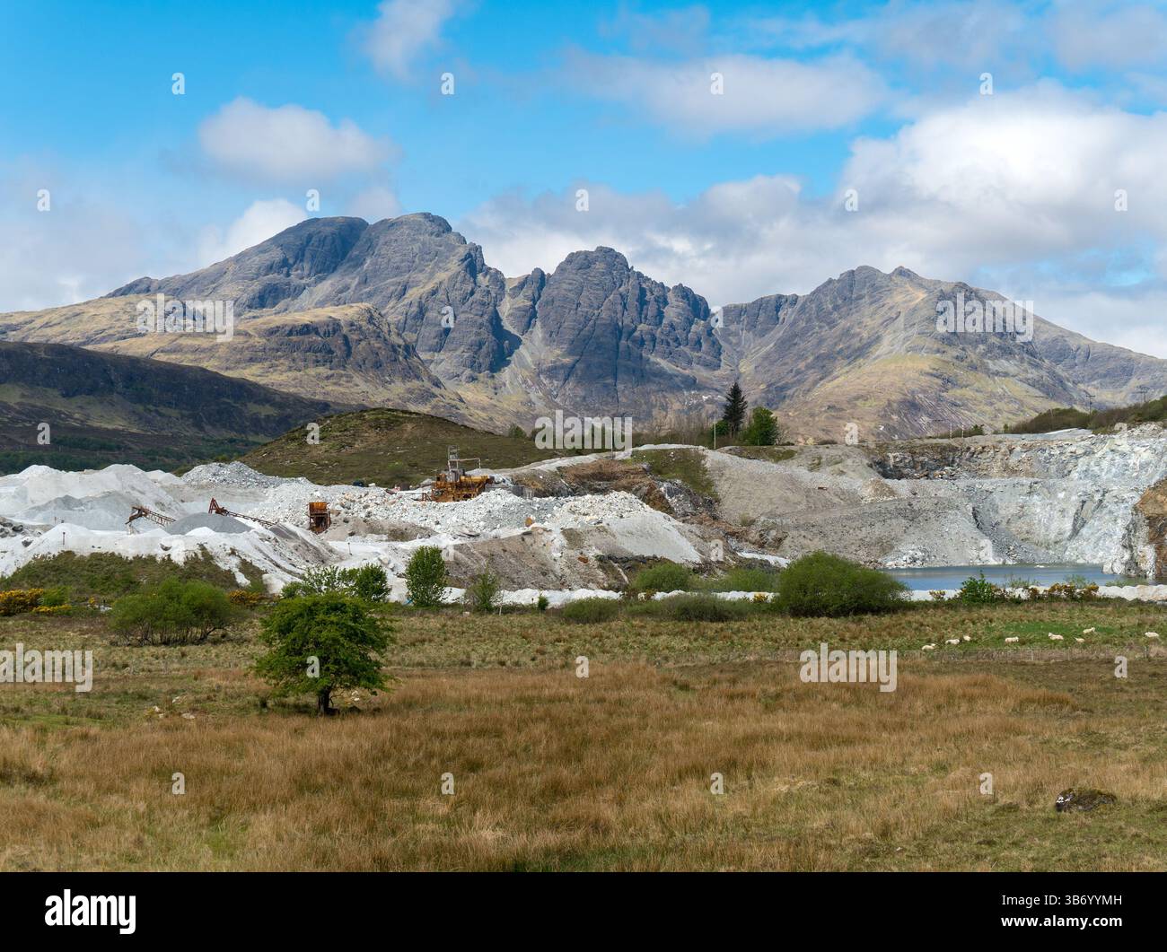 Torrin white marble quarry workings with Black Cuillin mountains beyond, Isle of Skye, Scotland, UK Stock Photo