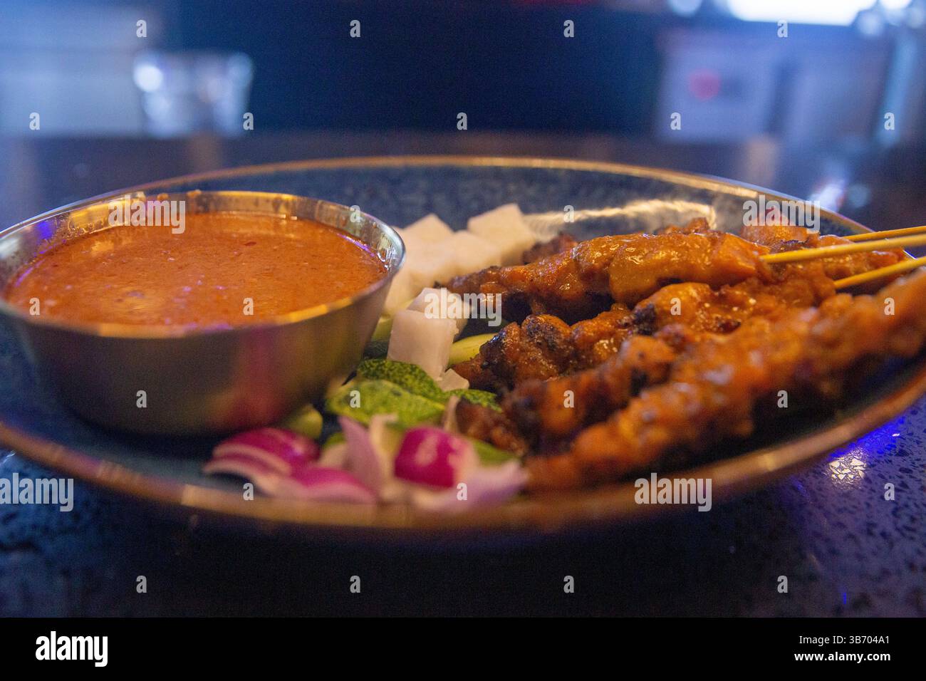 Malaysian style chicken satay with it's condiments Stock Photo - Alamy