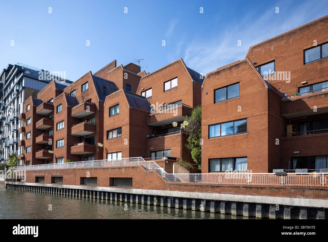 Curated visual reference: Tiered Apartment Building With Unique Features Reference: Modern Tiered Red Brick Apartment Buildings With Balconies Overlooking