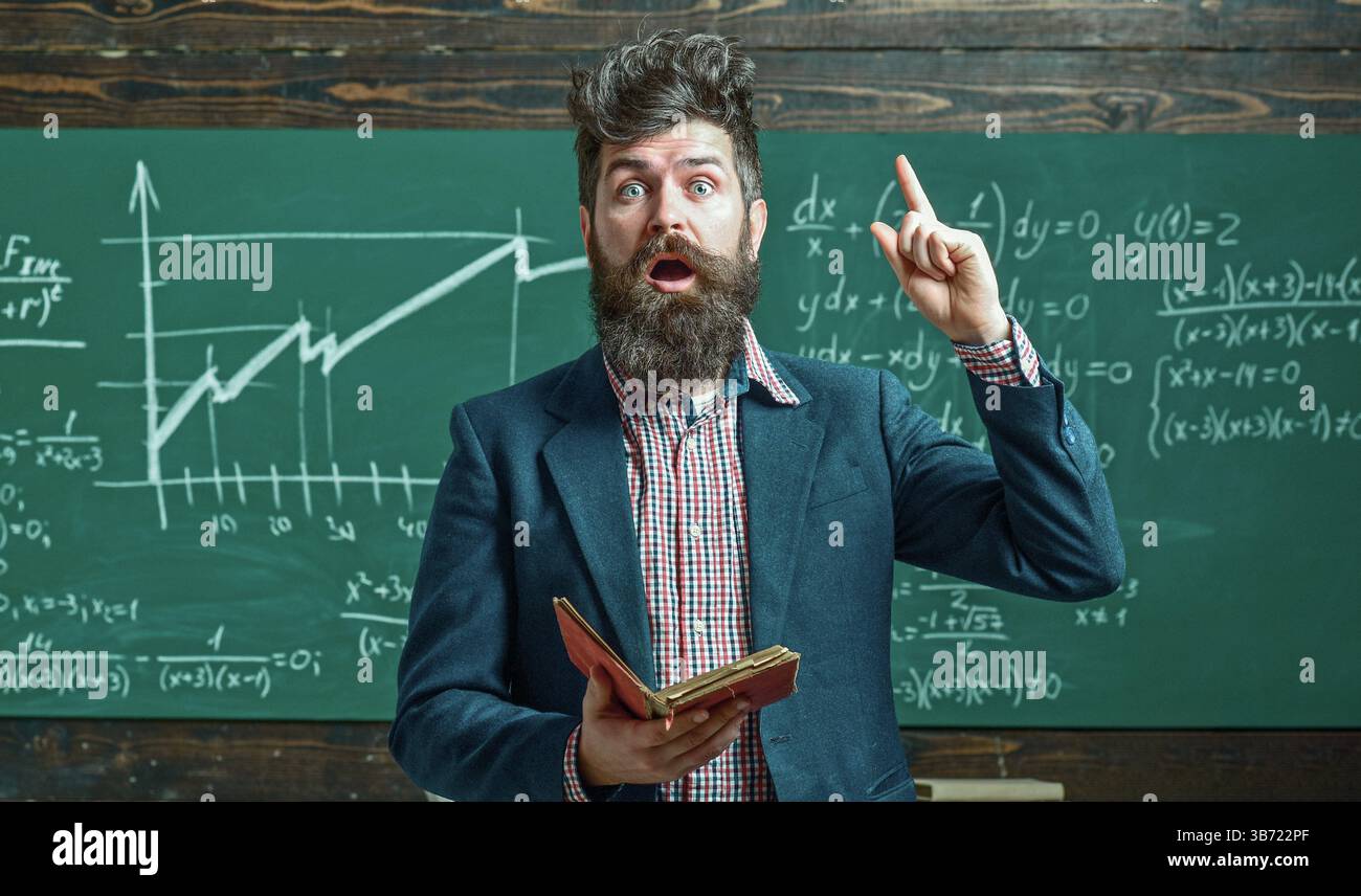 Teacher explains math. Professor in classroom on math lesson. School ...