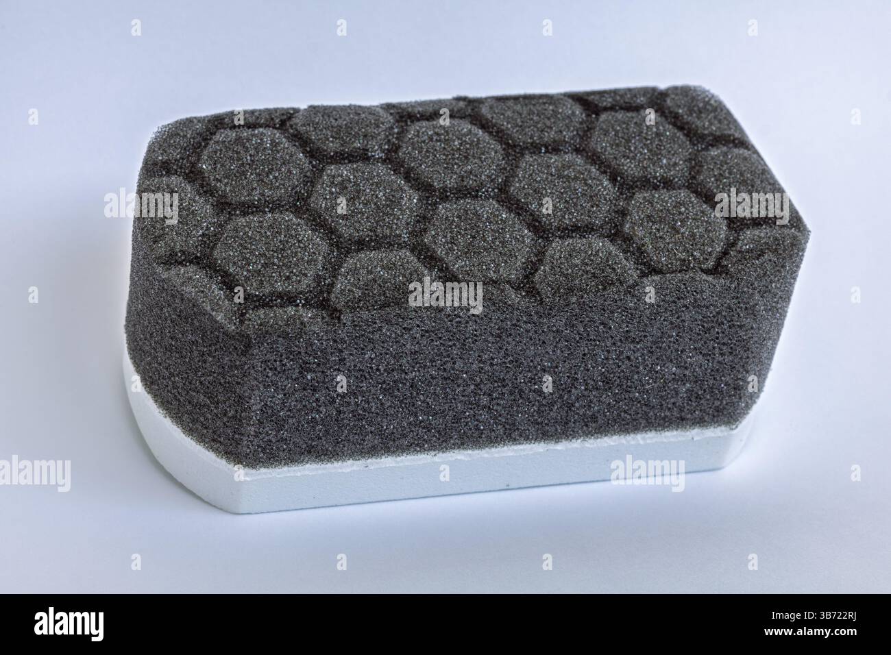 Car detailing applicator pad, black grey foam sponge with hexagon pattern Stock Photo